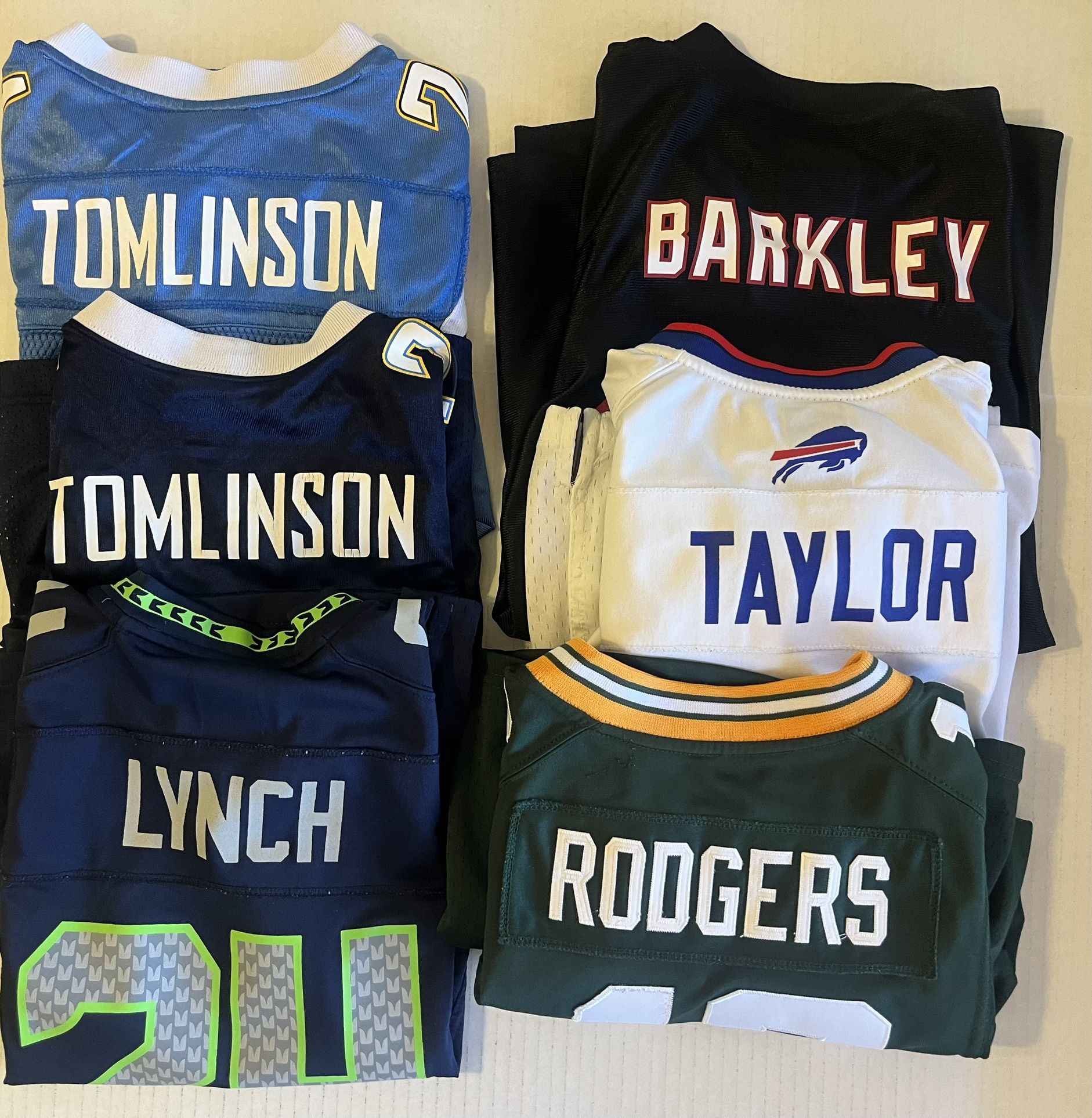 NFL Jerseys. Youth Sizes Small To Large. Tomlinson, Marshawn Lunch, Aaron Rodgers, Saquon Barkley