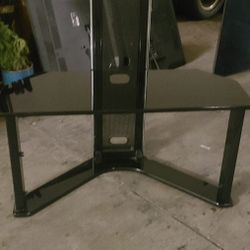 black glass shelf TV stand .bottom shelf is there at who just not in picture 