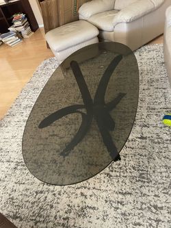Oval black glass table