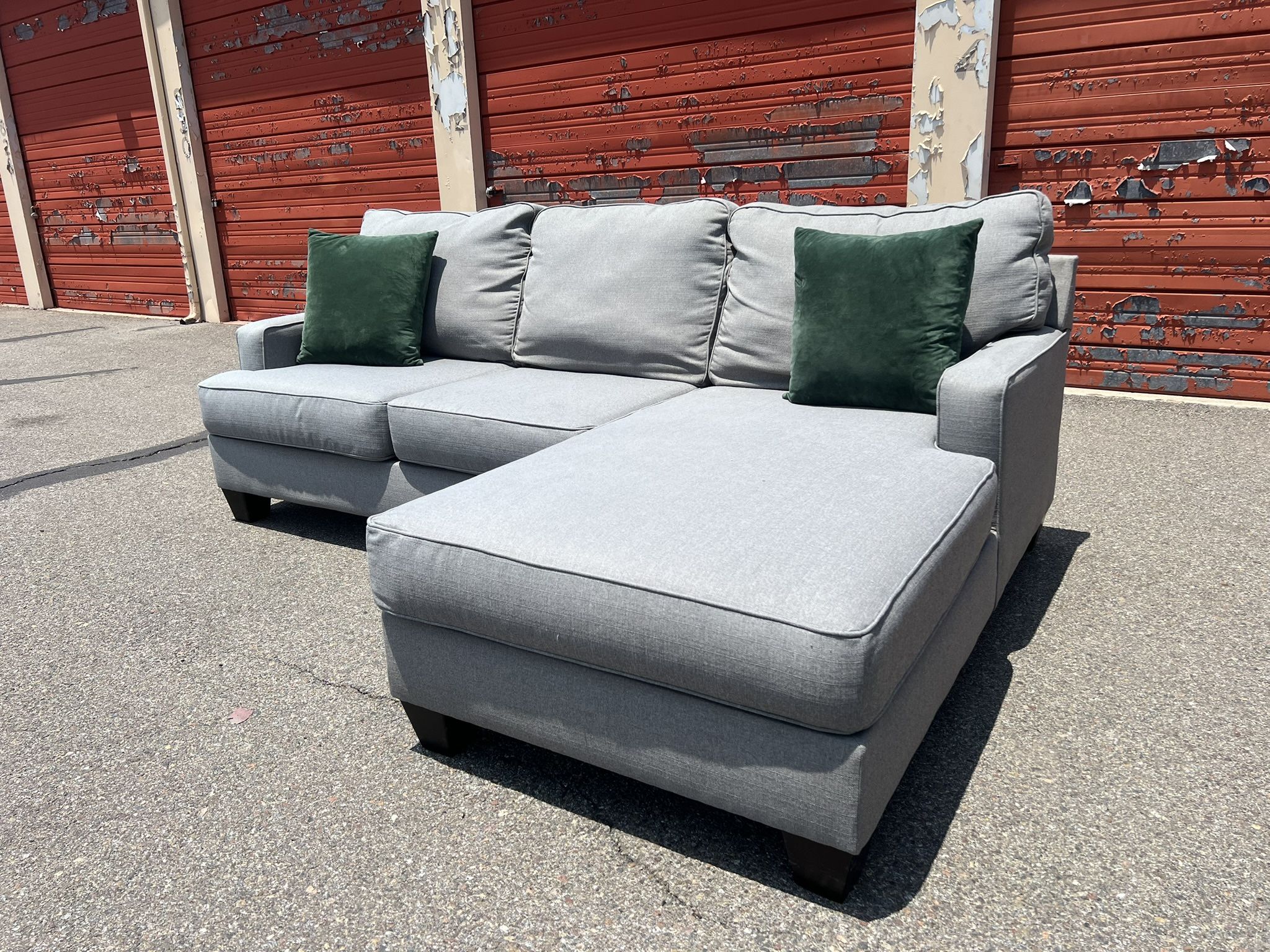 Ashley’s Gray Sectional Sofa Couch with right facing chaise