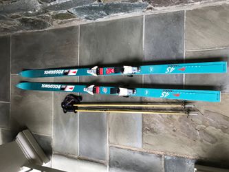 Set of woman’s Rossignol Snow Skis, boots and Kastle Poles