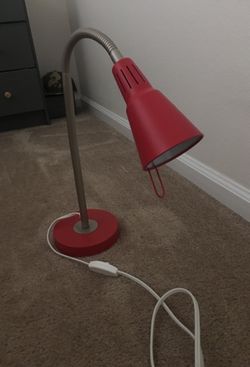 Red desk lamp. Adjustable. Bright and good condition
