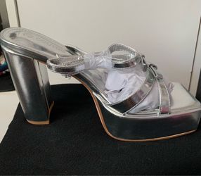 Silver platform heels, size 7 1/2.