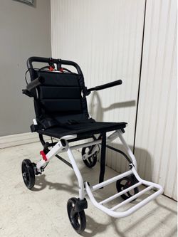 Folding transport wheelchair,