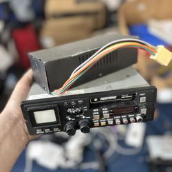 vintage Mustang brand car radio with an integrated cassette player.