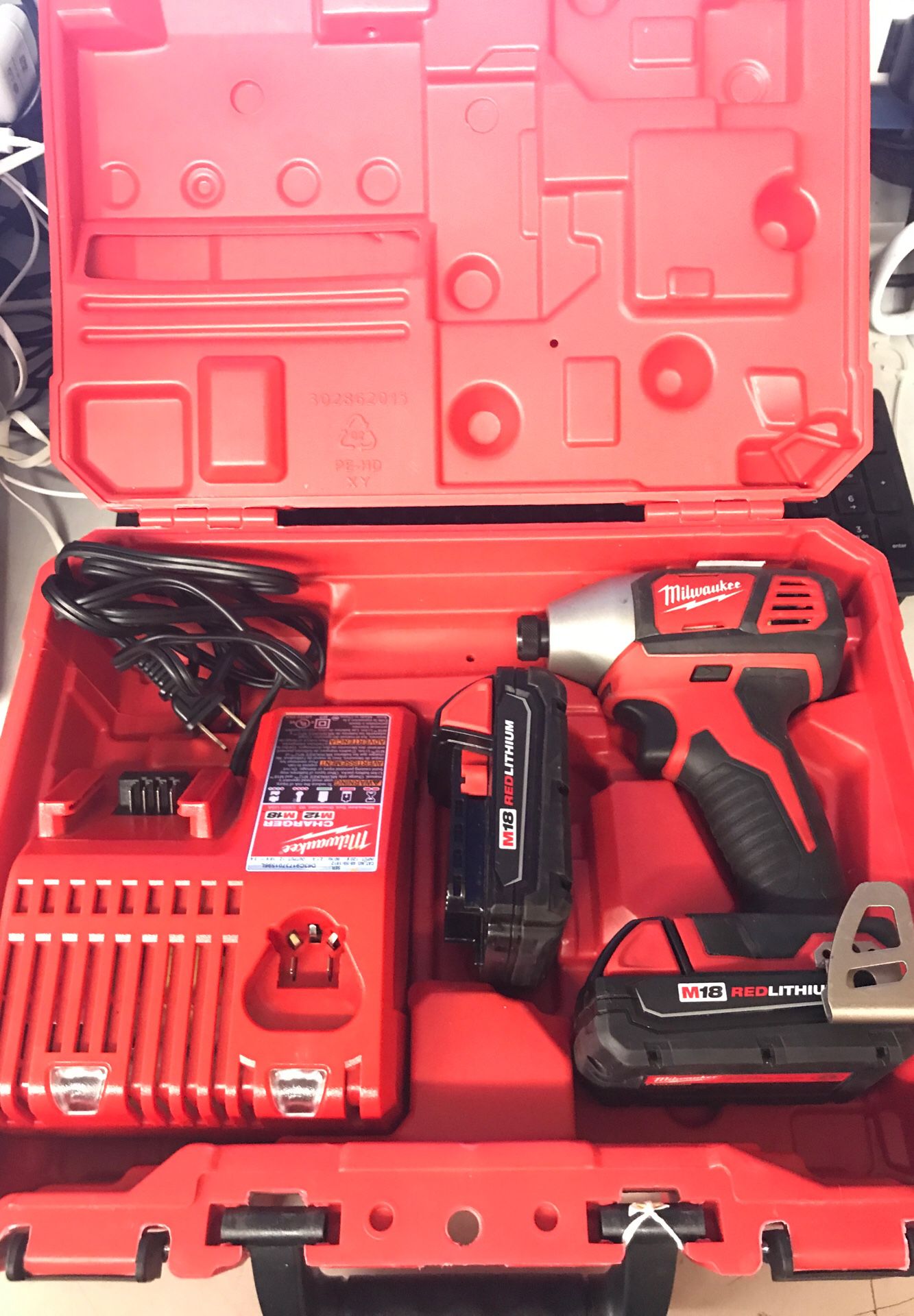 Milwaukee impact drill with charger and battery