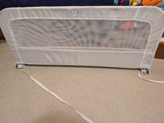 Swing down bed guard