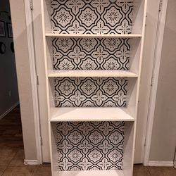 Bookshelf with black and white backing