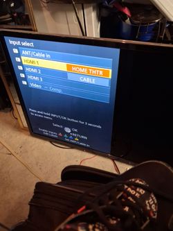 55 inch flat Smart TV (no remote but with with buttons.