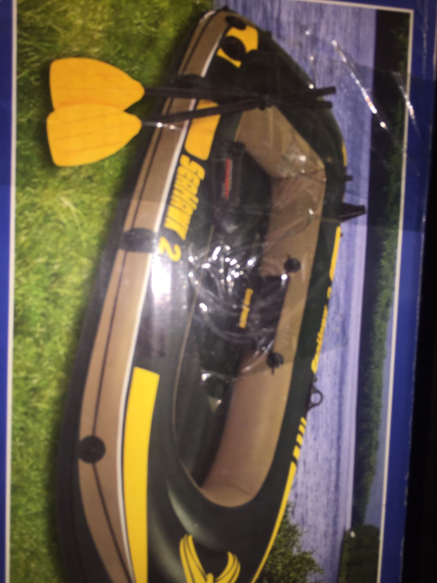 Inflatable paddle boat with oars