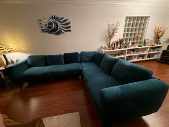 L shaped couch with velvet teal covers