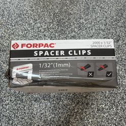 Brand new box of tile spacer clips. 2000 x 1/32” spacer clips.