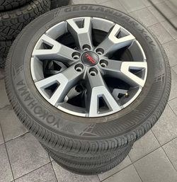 265/60R18 tire with 18” inch rims