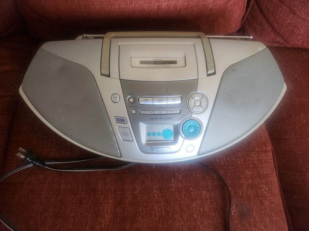 Portable Stereo System.  ((Panasonic _ ES20))  Caset  Radio   CD.