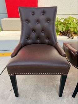 P U  LEATHER DINING CHAIR button tufted with nail head trim and ring pull