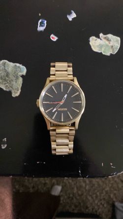Gold Nixon watch