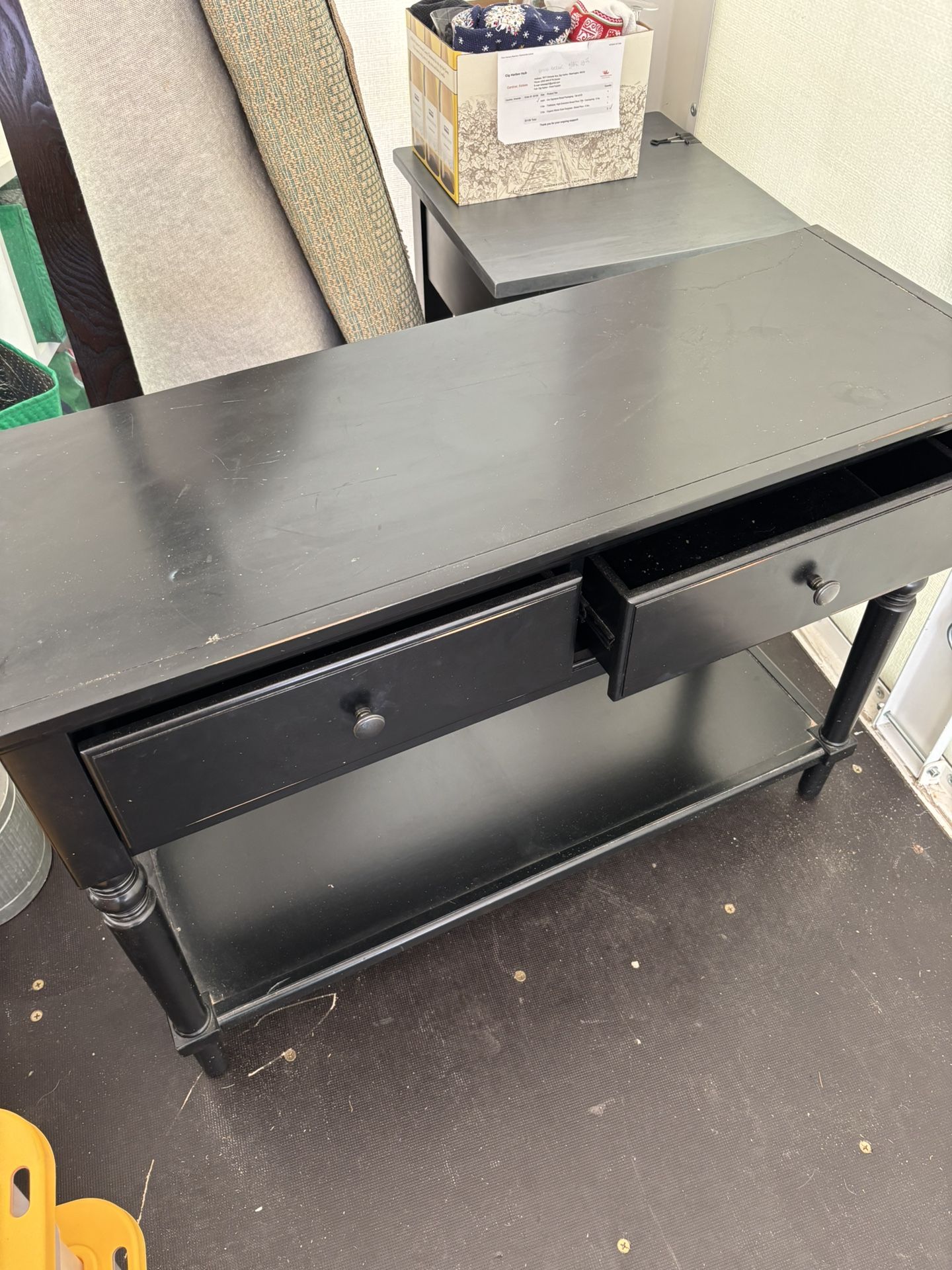 black distressed table with drawers