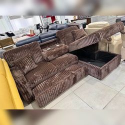 Brown Pull out sectional sofa with drop down table
