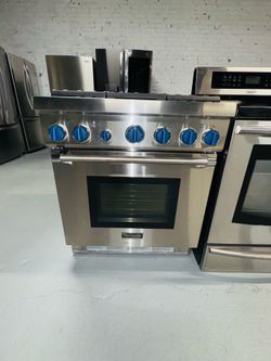 Thermador 30-inch wide propane gas stove, stainless steel; includes a receipt for a 90-day warranty.