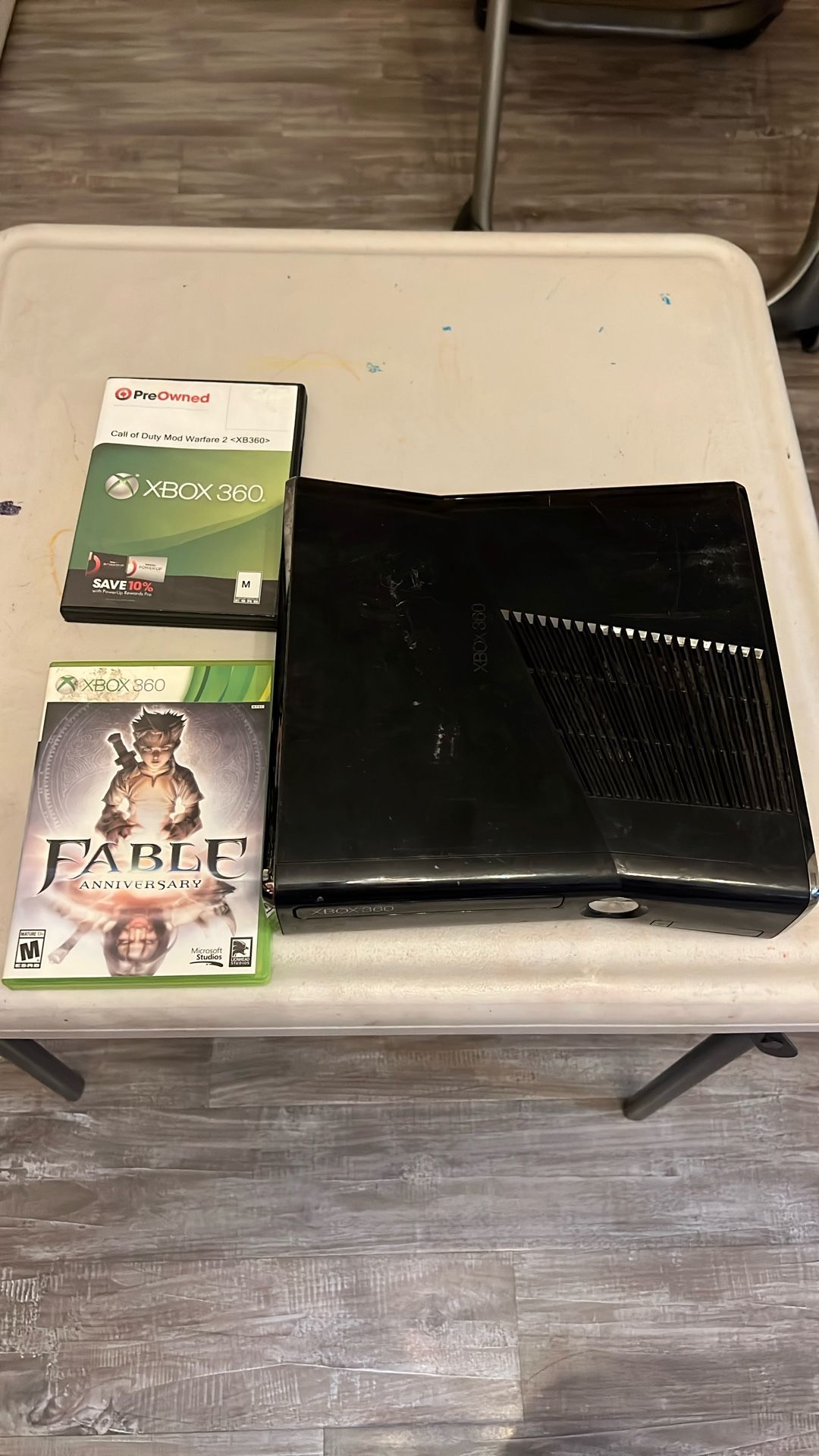 xbox 360 s with two games