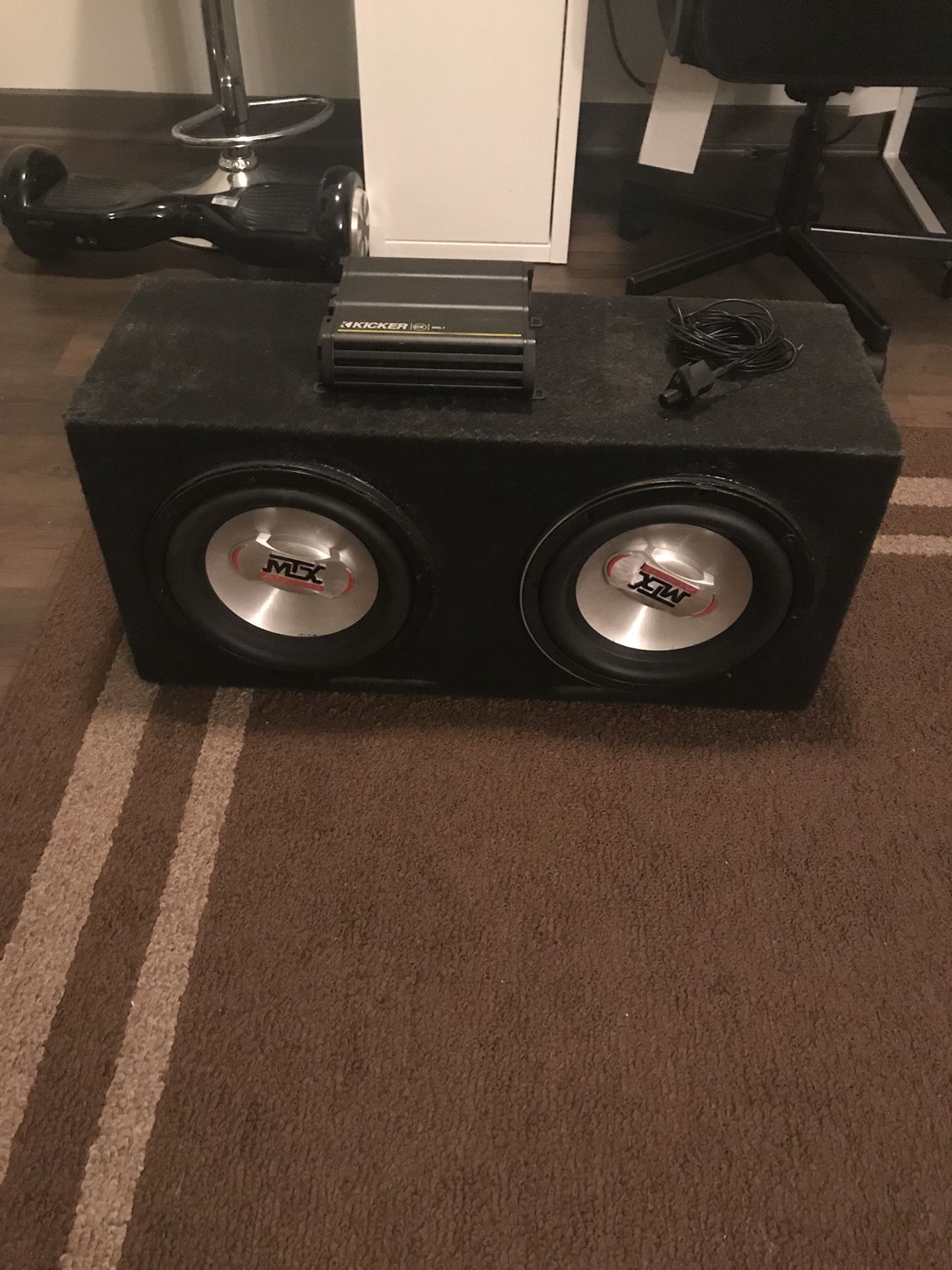 2 10” MTX Subwoofers in sealed carpeted enclosure including 600.1 kicker amp