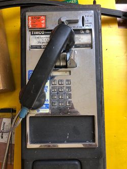 NYC payphone with wires
