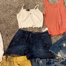 I have four pair that are a size 3, one pair that’s a size 2, one pair that’s a size 7, and then a pair of true religion cut off‘s that are 28. 