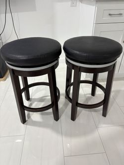 2 stools with spinning seat 25" tall and seat is 16"