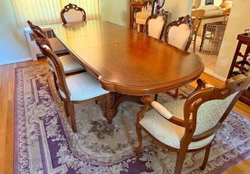 Dinning room table. Solid wood 6 chairs and covers Table and chairs always