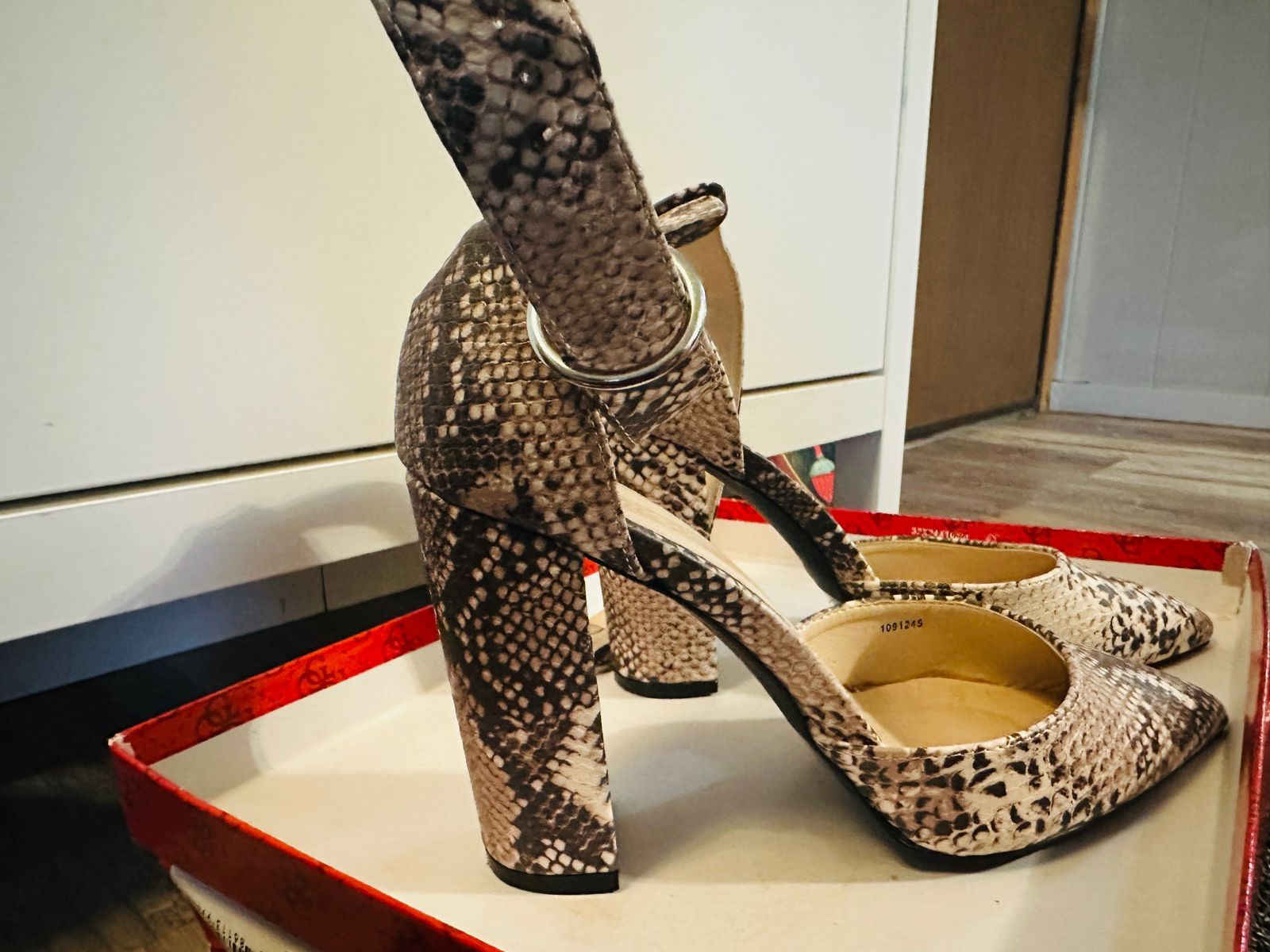 Stylish block-heel sandals with a chic snakeskin