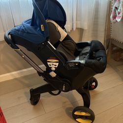 Doona Stroller + accessories 