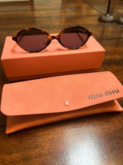 Miu Miu tortoise shell frame sunglasses