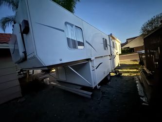 Trail Manor pop-up travel trailer.