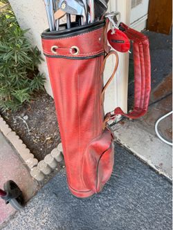 Antique gold clubs and bags