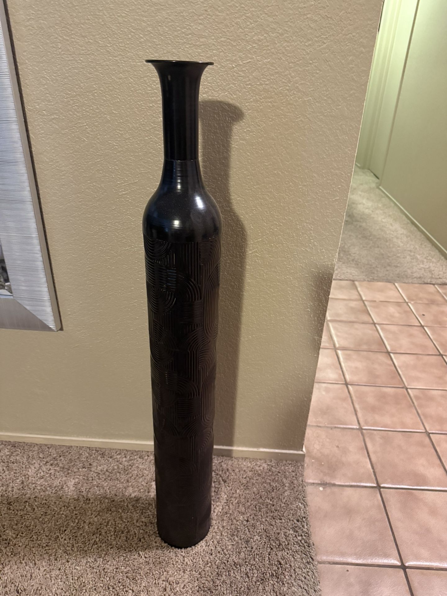 Tall, black engrave design vase