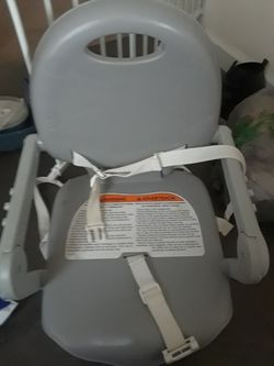 Strap in booster chair w attachable table