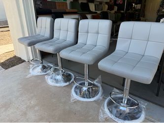 Brand new set of four adjustable height Bar stools only $60 each