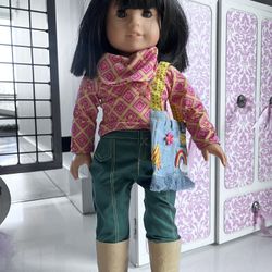 Rare American Girl doll with tons of outfits plus a trunk and closet. Practically new!