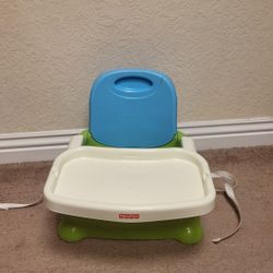 Fisher-Price Portable Toddler Booster Seat for Dining Table.