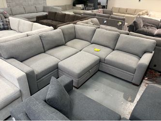 Gray fabric sectional with ottoman