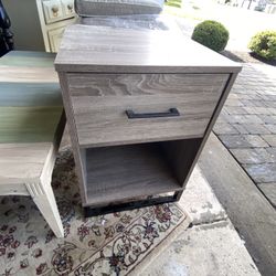 Two different end tables 40 for each