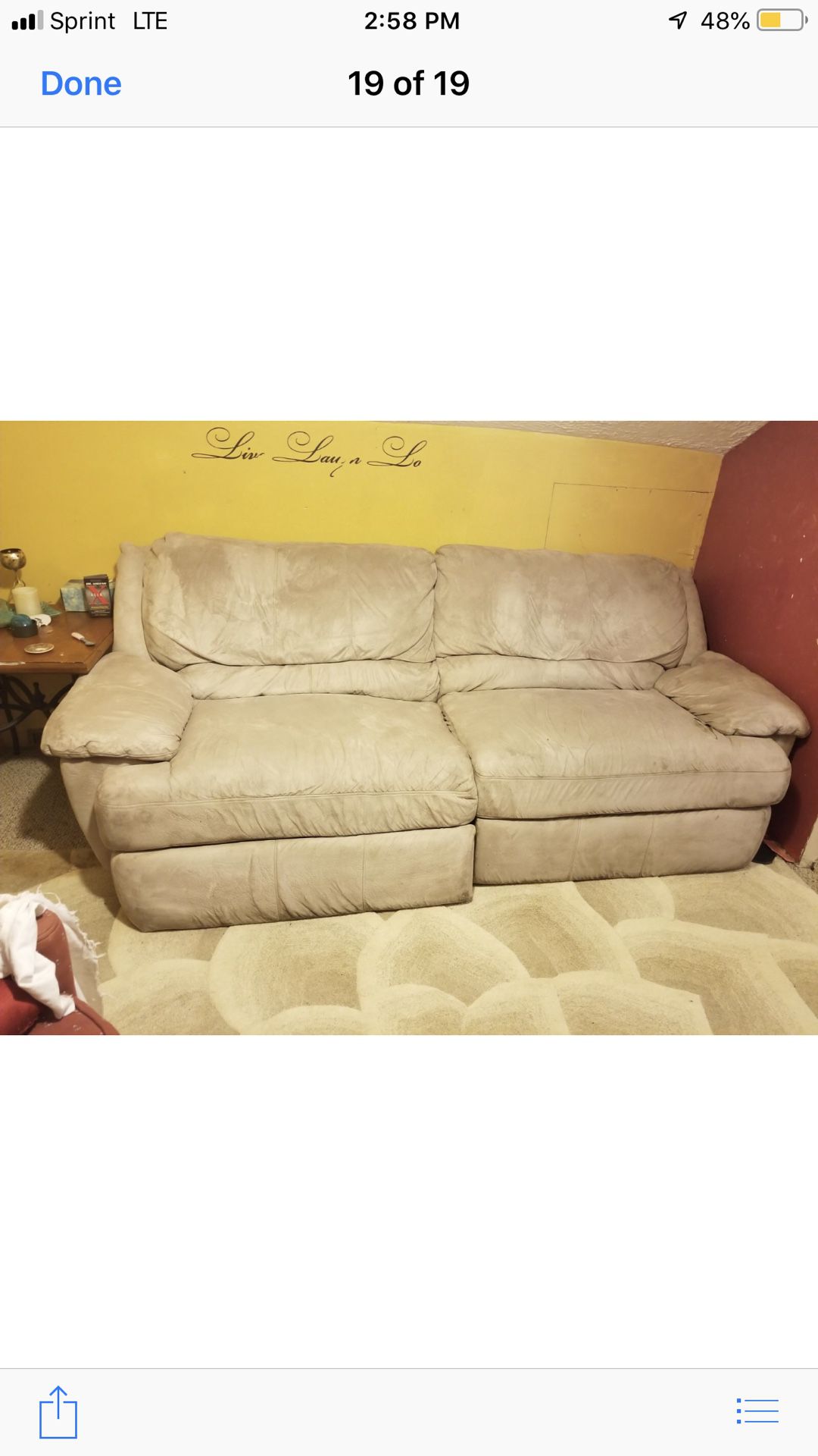 Creme color couch with electrical reclining on one side