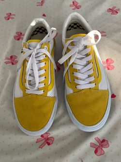 yellow and white Vans Old Skool low-top sneakers.