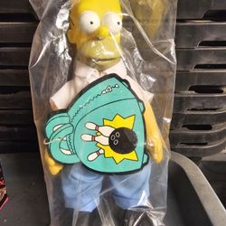 Vintage Homer Simpson doll, potentially from a 1990 Burger King Kids Meal toy set. 
