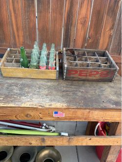Coke, Pepsi bottle wooden crate with some bottles