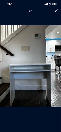 White wooden desk and rolling chair