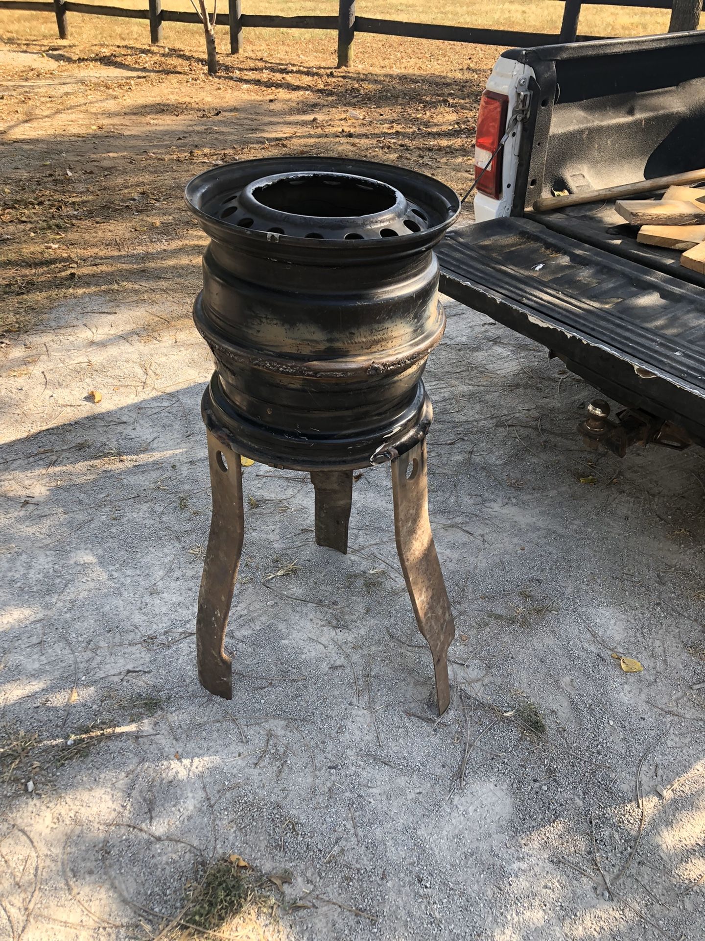 Outside wood stove with car rims