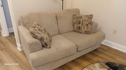 Love seat with throw pillows