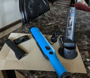 Shark® WandVac® Cordless Handheld Vacuum in blue with charging base