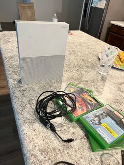 Xbox 1 s with like 4 games and a controller